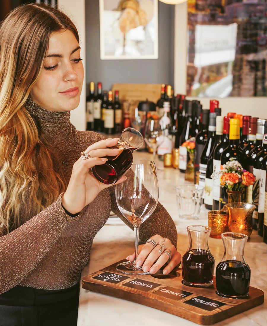 Pouring a Red Lovers wine flight at the Sospiro bar: Mencía, Chianti and Malbec