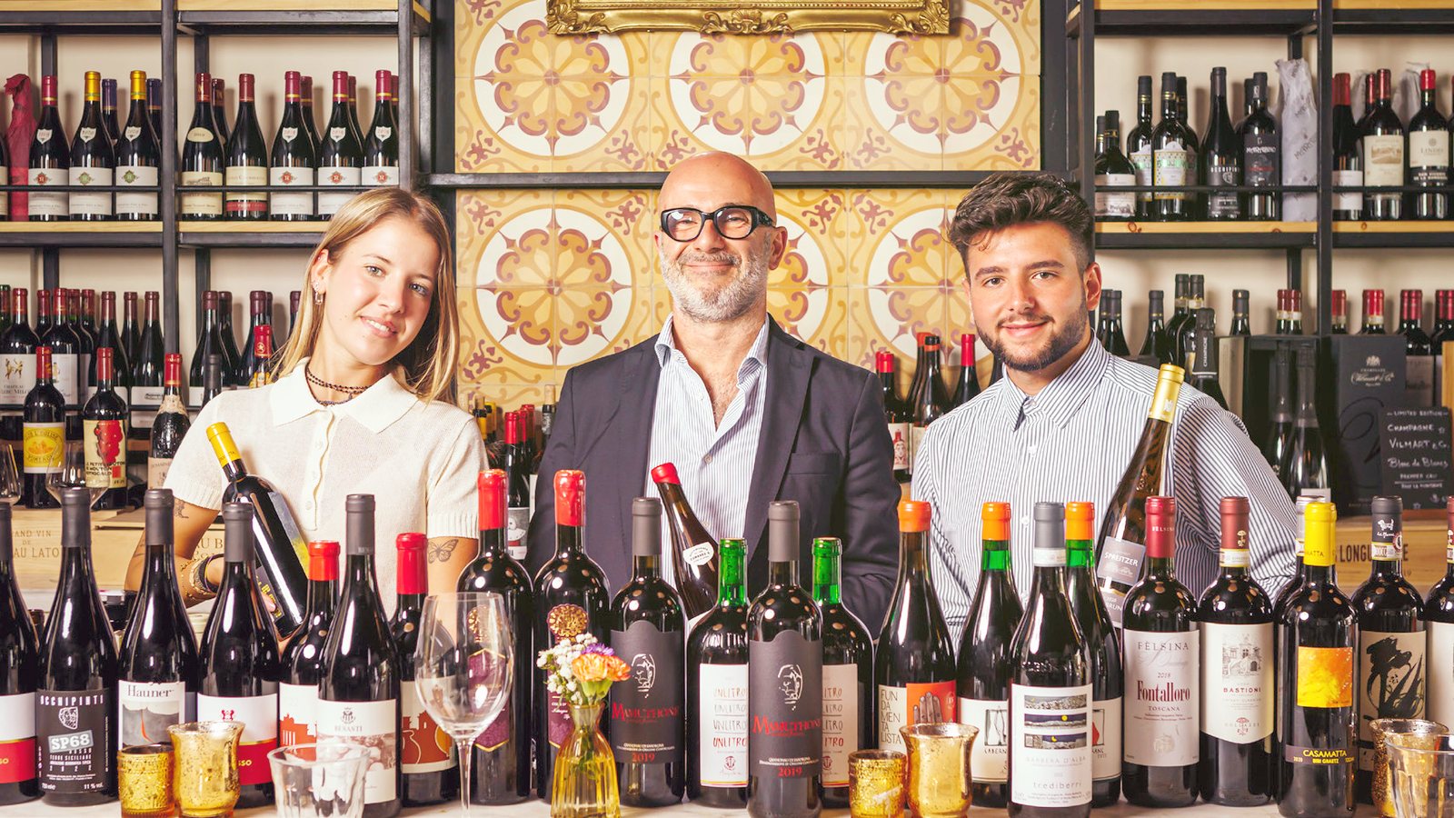Fabrizio Gallina with the Sospiro team in front of the wine wall, Coral Gables
