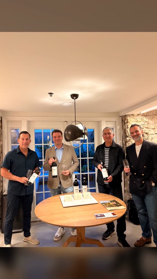 Guests holding bottles of Agricola Marrone Barolo at the FILO tasting in Coconut Grove